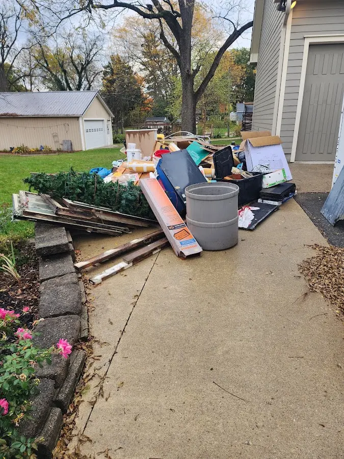 Dumpster being loaded with debris for 3 Yard Dumpster Rental in Marion